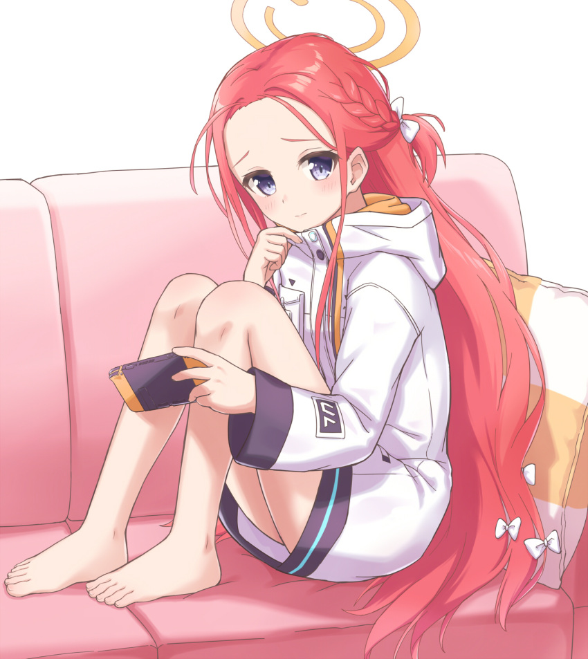 bare_legs barefoot blue_archive blue_eyes blush couch feet hair_ribbon halo handheld_game_console highres holding holding_handheld_game_console knees_up long_hair long_sleeves looking_at_viewer machikado no_shoes on_couch pillow red_hair ribbon sitting very_long_hair yuzu_(blue_archive)