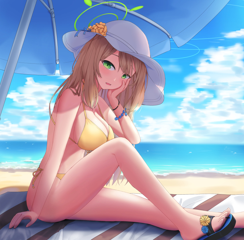 1girl :d absurdres arm_support ass beach beach_mat bikini blue_archive blue_sky blurry bracelet breasts brown_hair cleavage cloud cloudy_sky commentary_request depth_of_field feet foot_out_of_frame green_eyes hair_between_eyes halo hand_on_own_cheek hand_on_own_face hat head_rest head_tilt highres horizon jewelry knee_up large_breasts leaning_forward legs long_hair looking_at_viewer midriff nonomi_(blue_archive) nonomi_(swimsuit)_(blue_archive) ocean official_alternate_costume outdoors sandals side-tie_bikini_bottom sidelocks sitting sky sleeveless smile solo spaghetti_strap sun_hat swimsuit toes white_headwear wjddn yellow_bikini