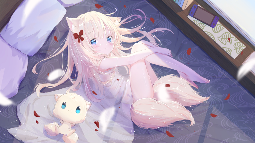 1girl :o absurdres animal_ears bare_arms bare_legs bare_shoulders barefoot blonde_hair blue_eyes blush commentary_request dress handheld_game_console highres hugging_own_legs long_hair looking_at_viewer lying multiple_tails on_side original parted_lips peas_(peas0125) petals pillow sleeveless sleeveless_dress solo tail two_tails very_long_hair white_dress