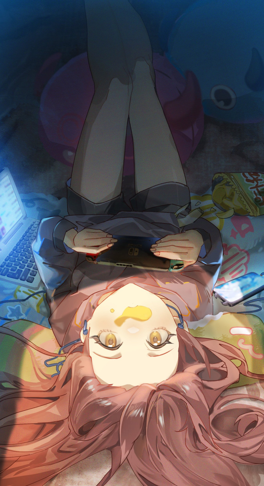 1girl absurdres bare_legs black_hoodie black_shorts blush brown_hair cellphone chips_(food) computer controller cushion debi_tarou earphones feet_out_of_frame food food_on_face forehead game_controller hair_spread_out highres holding holding_controller holding_game_controller hood hoodie idolmaster idolmaster_shiny_colors indoors laptop legs_up looking_at_viewer mokuto mouth_hold nintendo_switch osaki_tenka phone potato_chips shorts solo upside-down