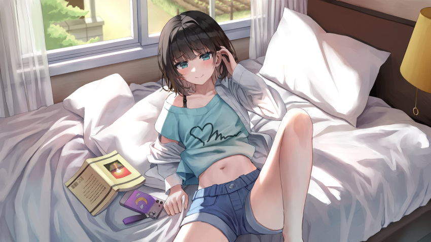 1girl bare_legs bed black_hair blue_shirt blue_shorts book bra_strap closed_mouth crop_top denim denim_shorts green_eyes hand_up highres jacket knee_up looking_at_viewer midriff navel off_shoulder on_bed open_clothes open_jacket original pillow shirt short_hair short_shorts short_sleeves shorts sitting smile solo stomach superpig thighs white_jacket