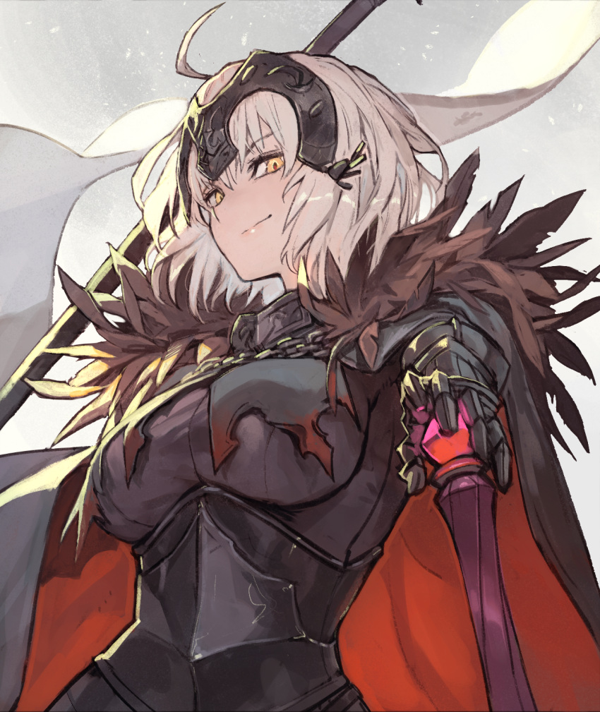 1girl ahoge armor armored_dress blonde_hair breasts cape cowboy_shot fate/grand_order fate_(series) from_below from_side fur-trimmed_cape fur_trim headphones highres jeanne_d'arc_alter_(avenger)_(fate) jeanne_d'arc_alter_(fate) lack light_smile looking_at_viewer medium_breasts planted red_cape smile solo standard_bearer white_background yellow_eyes