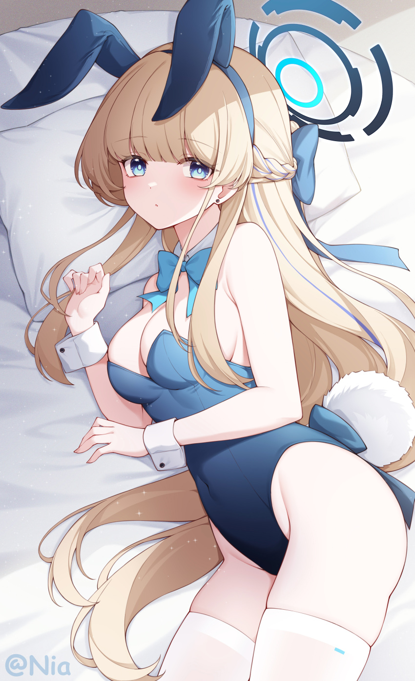 1girl absurdres animal_ears aqua_bow aqua_bowtie bare_arms bare_shoulders blonde_hair blue_archive blue_eyes blue_hairband blue_leotard blush bow bowtie breasts detached_collar fake_animal_ears fake_tail hair_ornament hairband halo highres large_breasts leotard long_hair looking_at_viewer lying on_side pillow playboy_bunny poinia rabbit_ears rabbit_tail solo tail thighhighs thighs toki_(blue_archive) toki_(bunny)_(blue_archive) twitter_username white_thighhighs wrist_cuffs