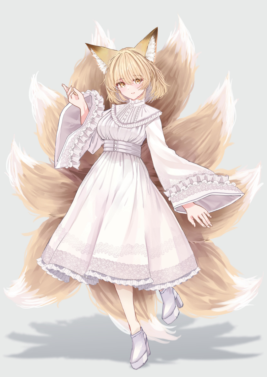 1girl animal_ears blonde_hair blush boots closed_mouth dress fox_ears fox_tail full_body grey_background high_heel_boots high_heels highres long_sleeves multiple_tails sarasadou_dan short_hair simple_background smile solo tail touhou white_dress white_footwear wide_sleeves yakumo_ran yellow_eyes