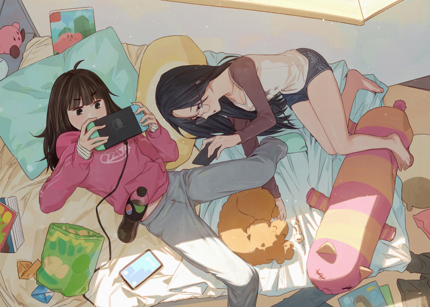 2girls absurdres aqua_socks barefoot bed bed_sheet black_hair blue_eyes blue_shorts book brown_eyes brown_hair cable cellphone chips_(food) ddini dog food glasses grey_pants handheld_game_console highres holding holding_handheld_game_console holding_phone hood hoodie kirby kirby_(series) long_sleeves lying magazine_(object) multicolored_clothes multiple_girls nintendo_switch on_back on_side origami original pants pepsi phone pillow pink_hoodie shirt shorts sleeves_past_wrists smartphone socks soda_bottle striped striped_shirt stuffed_animal stuffed_toy tablet_pc window