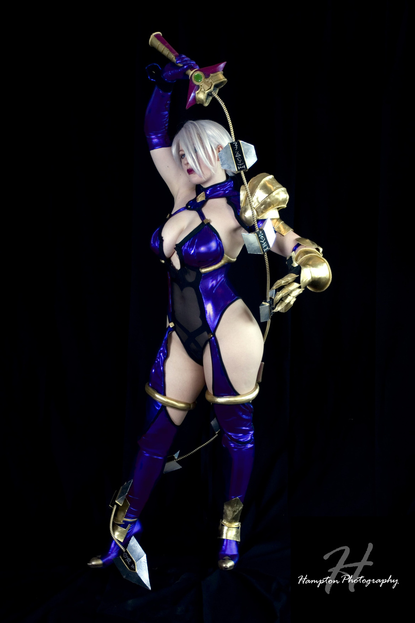 absurdres armor blue_eyes breasts claws cleavage cosplay gloves hair_over_one_eye highres isabella_valentine large_breasts photo solo soulcalibur white_hair