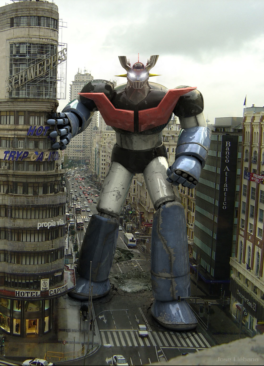 car city damaged dirty epic glowing glowing_eyes ground_vehicle highres landmark madrid mazinger_z mazinger_z_(mecha) mecha motor_vehicle no_humans photo_background realistic road science_fiction spain street super_robot third-party_edit