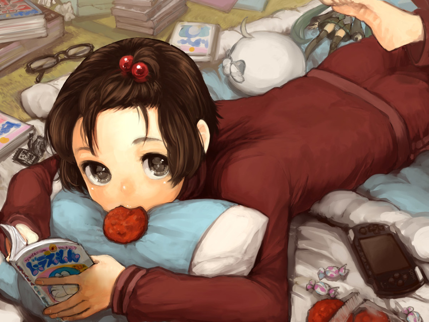 androgynous axis_powers_hetalia bad_id bad_pixiv_id barefoot book brown_eyes brown_hair candy figure food glasses hair_bobbles hair_ornament handheld_game_console hatsune_miku japan_(hetalia) kumatani lying male_focus manga_(object) mouth_hold on_stomach otaku otoko_no_ko pillow playstation_portable solo track_suit vocaloid