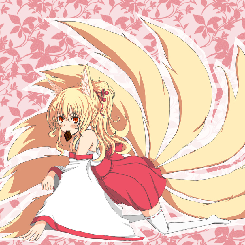 all_fours animal_ears azure_luna bare_shoulders blonde_hair chocolate detached_sleeves fox_ears fox_tail hair_ornament hairpin highres long_hair mouth_hold multiple_tails orange_eyes original ponytail solo tail thighhighs white_legwear zettai_ryouiki