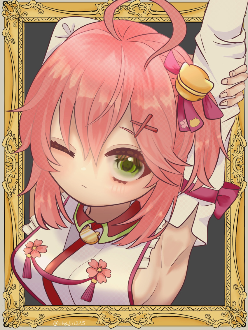 1girl ahoge arms_up bell border breasts chajo1225 cross_hair_ornament detached_sleeves eyelashes green_eyes hair_bell hair_ornament highres hololive looking_at_viewer one_eye_closed one_side_up ornate_border outside_border picture_frame pink_hair portrait sakura_miko sakura_miko_(1st_costume) sideboob solo stretching virtual_youtuber