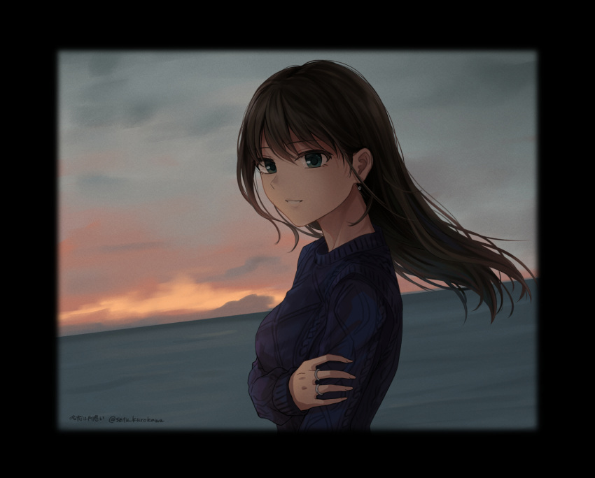 1girl blue_sweater brown_hair cloud cowboy_shot earrings green_eyes hair_between_eyes hand_on_own_arm highres jewelry looking_at_viewer medium_hair multiple_rings ocean original picture_frame profile ring setu_kurokawa smile solo sunset sweater