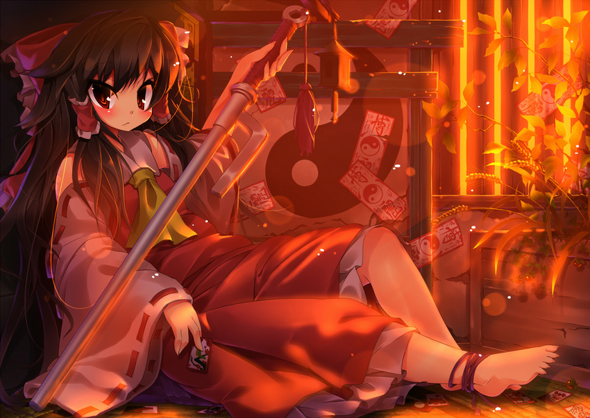 anklet barefoot between_fingers brown_hair evening full_body hair_tubes hakurei_reimu jewelry jitte koha long_hair ofuda red red_eyes sitting solo sunlight sunset touhou weapon wheat wide_sleeves yin_yang