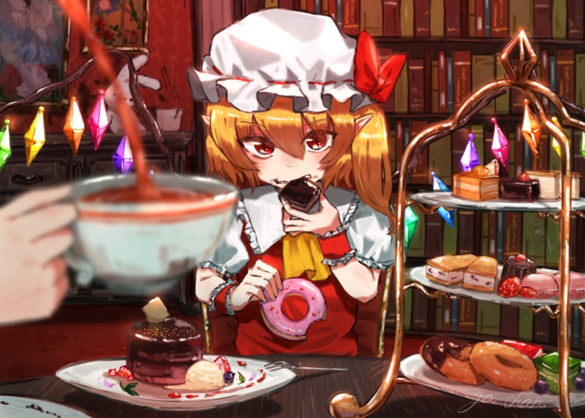 1girl 1other ascot blonde_hair blurry blurry_foreground bookshelf cake cowboy_shot crystal_wings cup doughnut eating flandre_scarlet food ga-chan24 hat hat_ribbon indoors mob_cap pointy_ears red_ribbon ribbon sitting solo_focus table tea teacup touhou yellow_ascot