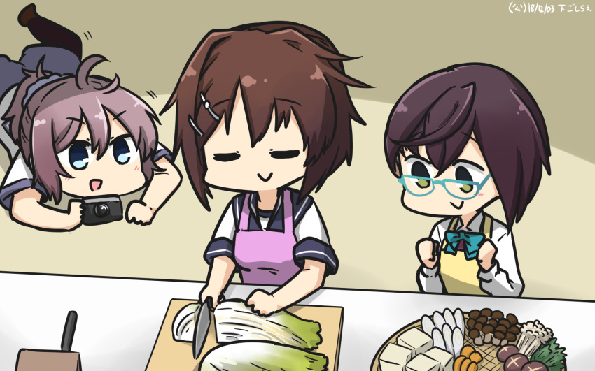 3girls aoba_(kantai_collection) apron black_legwear blue-framed_eyewear blue_eyes brown_hair camera chopping commentary_request counter cutting_board dated dress eyes_closed food furutaka_(kantai_collection) green_eyes hair_ornament hairclip hamu_koutarou highres kantai_collection knife lying messy_hair multiple_girls mushroom okinami_(kantai_collection) on_stomach pink_apron ponytail purple_hair purple_shorts school_uniform scrunchie serafuku shirt short_hair shorts sleeveless sleeveless_dress standing thighhighs tofu tray white_shirt yellow_apron