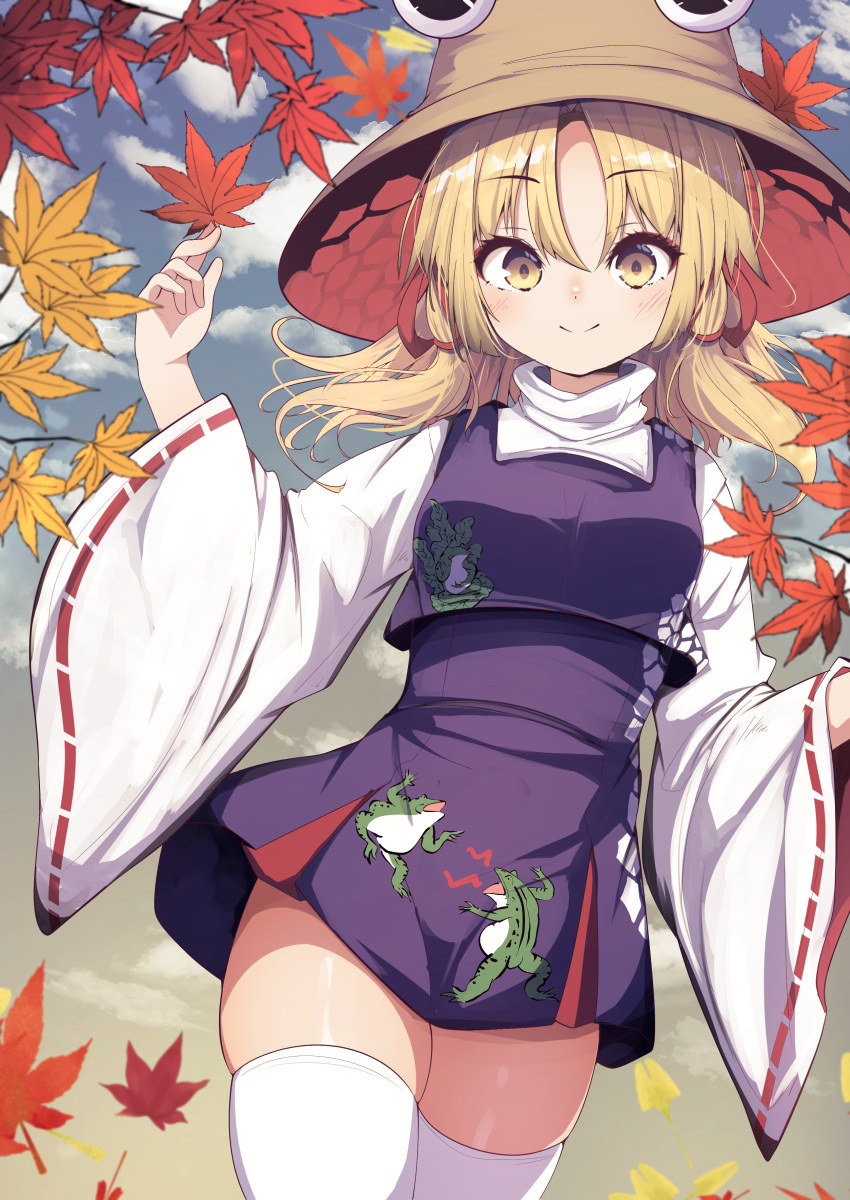 1girl absurdres animal_print autumn autumn_leaves blonde_hair blurry blurry_foreground breasts brown_headwear closed_mouth cloud commentary_request cowboy_shot darumoon day falling_leaves frog_print hat high-waist_skirt highres holding holding_leaf leaf leaf_background light_blush long_sleeves looking_at_viewer maple_leaf miniskirt moriya_suwako nature outdoors parted_bangs partial_commentary purple_skirt purple_vest red_ribbon ribbon ribbon-trimmed_sleeves ribbon_trim shirt sidelocks skindentation skirt skirt_set small_breasts smile snake_print solo split_mouth standing thick_thighs thighhighs thighs touhou turtleneck vest white_thighhighs wide_sleeves yellow_eyes zettai_ryouiki