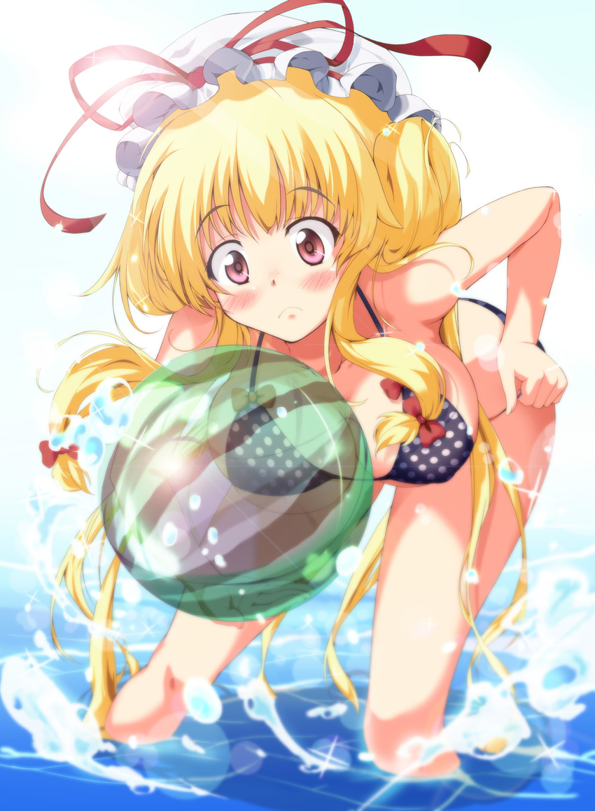 ball bent_over bikini blonde_hair blue_sky blurry blush bow breasts cloud day depth_of_field embarrassed eyebrows eyebrows_visible_through_hair hair_bow hair_up hand_on_hip hat hat_ribbon highres hips holding holding_ball large_breasts lens_flare light_particles light_rays long_hair mob_cap nanase_nanami ocean partially_submerged polka_dot polka_dot_bikini polka_dot_swimsuit purple_eyes ribbon sky solo sparkle splashing standing summer sunlight swimsuit thighs touhou transparent very_long_hair water yakumo_yukari
