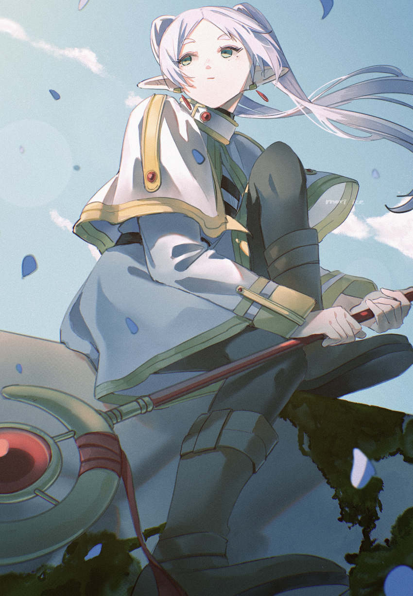 1girl absurdres blue_petals blue_sky capelet drop_earrings earrings elf frieren highres holding holding_staff ice_morinaka jewelry mage_staff moss parted_bangs perspective pointy_ears rock sitting sitting_on_rock sky solo sousou_no_frieren staff twintails white_capelet wind wind_lift