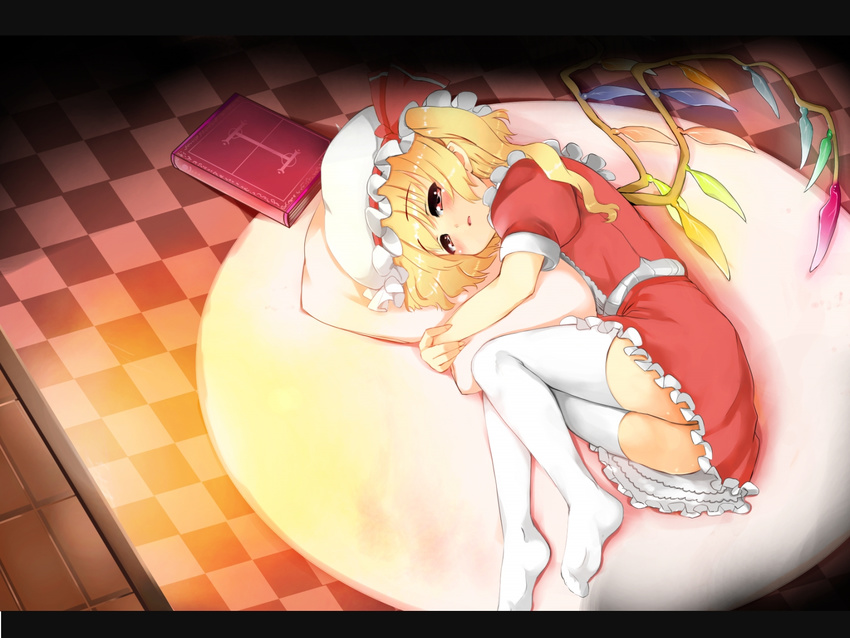 blonde_hair blush book checkered checkered_floor flandre_scarlet hat highres legs lying on_side pillow pillow_hug ponytail red_eyes short_hair side_ponytail solo thighhighs toichi touhou white_legwear wings