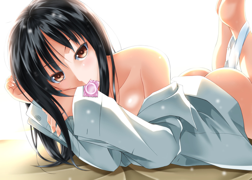 ass bare_shoulders barefoot black_hair brown_eyes condom_wrapper long_hair lying mouth_hold on_stomach shirt solo sumeragi_tomo