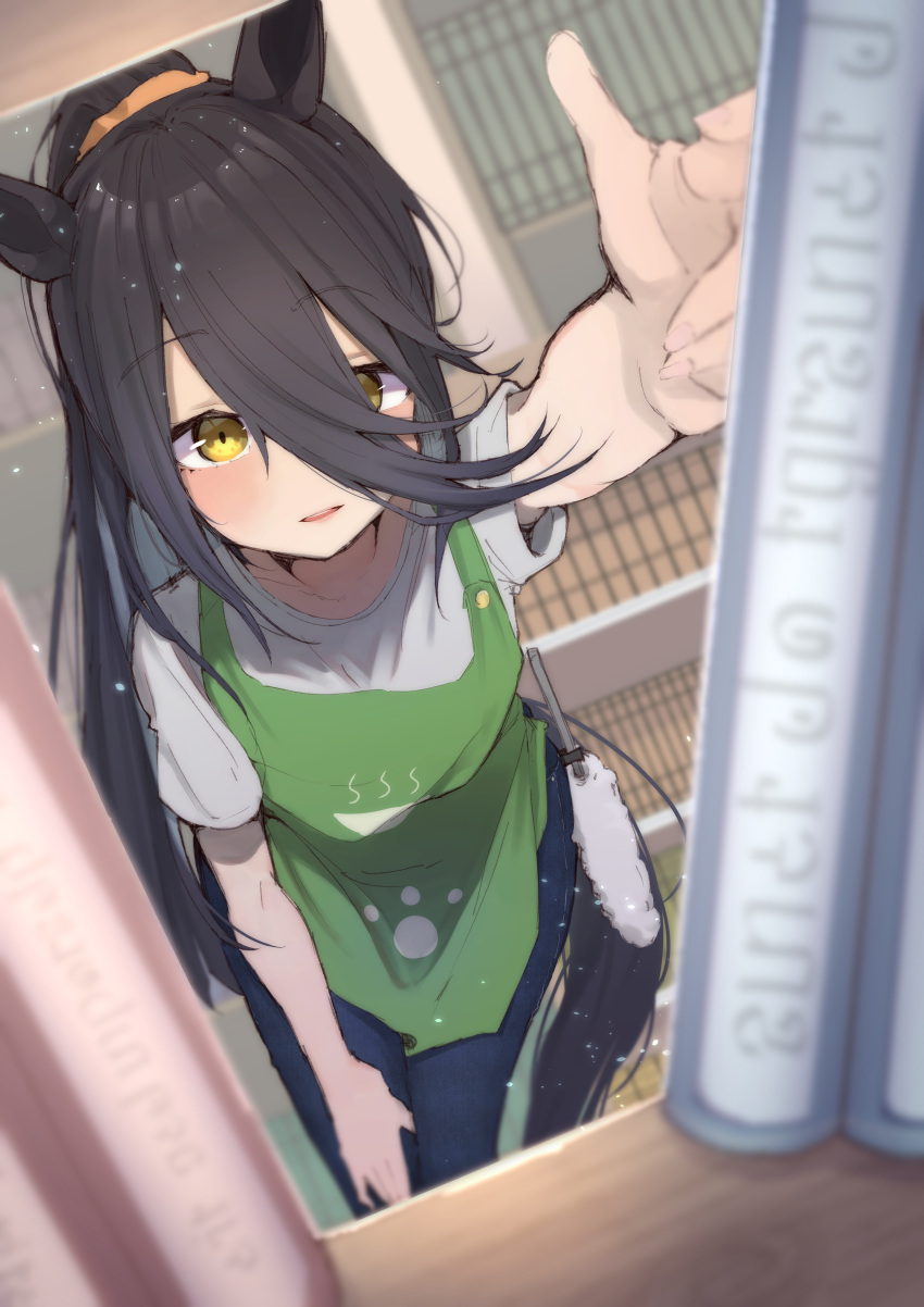 1girl absurdres alternate_costume alternate_hairstyle animal_ears apron black_hair blurry blurry_background blush bookshelf commentary_request cowboy_shot denim gorioshi0802 green_apron grey_shirt hair_between_eyes highres horse_ears horse_girl horse_tail jeans long_hair manhattan_cafe_(umamusume) open_mouth pants ponytail shirt short_sleeves smile solo standing tail umamusume yellow_eyes