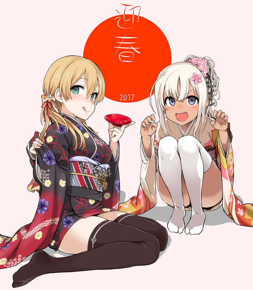 2girls :d :q asanagi bangs black_legwear blonde_hair blush claw_pose cup fang floral_print flower hair_flower hair_ornament highres iron_cross japanese_clothes kantai_collection kimono multiple_girls nengajou new_year no_shoes open_mouth ponytail prinz_eugen_(kantai_collection) ro-500_(kantai_collection) sakazuki short_kimono sitting smile tabi tan tanline thighhighs tongue tongue_out twintails v-shaped_eyebrows wariza white_legwear wide_sleeves