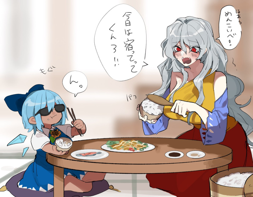 2girls blue_dress blue_hair blurry blurry_background blush breasts chewing chopsticks cirno cushion dress food fuuga_(perv_rsity) holding holding_food ice ice_wings multicolored_clothes multicolored_dress multiple_girls open_mouth red_eyes sakata_nemuno short_sleeves sitting strapless strapless_dress sunglasses table tanned_cirno touhou translation_request wings