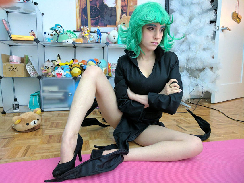 1girl black_dress cosplay curly_hair dress frown green_eyes green_hair lana_rain one-punch_man photo short_hair solo tatsumaki