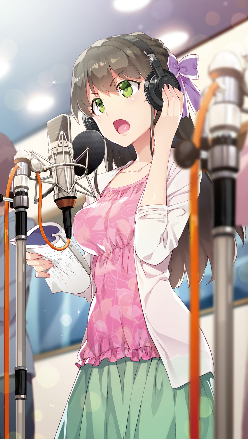 absurdres black_hair breasts chuuko_demo_koi_ga_shitai! collarbone green_eyes green_skirt hair_ribbon hatsushiba_yuuka headphones highres holding indoors long_hair medium_breasts microphone microphone_stand open_mouth pink_shirt purple_ribbon recording_studio redrop ribbon script shirt skirt solo standing studio_microphone