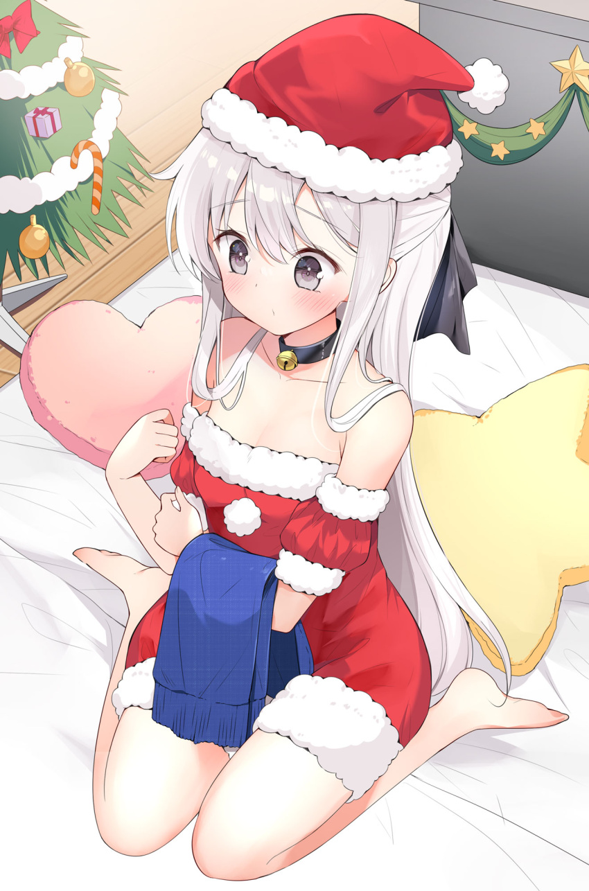 1girl bare_shoulders barefoot bell black_choker choker christmas_ornaments christmas_present christmas_stocking christmas_tree detached_sleeves dress gift grey_eyes grey_hair hamaken._(novelize) hat heart heart-shaped_pillow highres jingle_bell long_hair on_bed original pillow santa_dress santa_hat short_sleeves solo star-shaped_pillow thighs