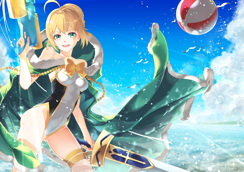 ahoge annojou_haruto artoria_pendragon_(all) artoria_pendragon_(swimsuit_archer) ball beachball blonde_hair cape cloud competition_swimsuit day excalibur fate/grand_order fate/stay_night fate_(series) fur-trimmed_cape fur_trim green_eyes hair_bun one-piece_swimsuit solo swimsuit sword water water_gun weapon