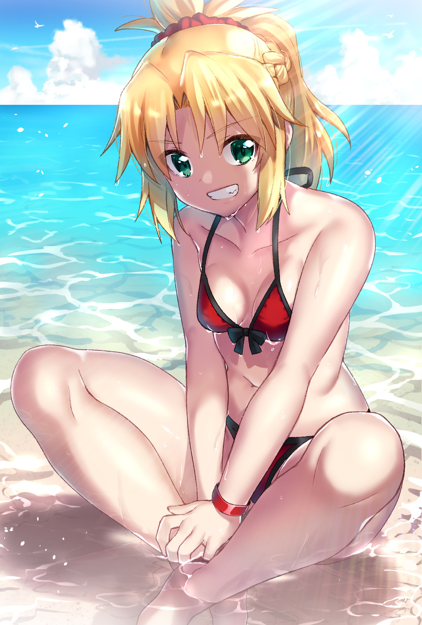 bad_id bad_pixiv_id beach bikini blonde_hair blue_sky blush bracelet braid breasts cleavage cloud collarbone day eyebrows_visible_through_hair fate/grand_order fate_(series) green_eyes grin highres horizon ichiren_namiro indian_style jewelry looking_at_viewer medium_breasts mordred_(fate)_(all) mordred_(swimsuit_rider)_(fate) ocean outdoors parted_lips ponytail red_bikini short_hair short_ponytail sitting sky smile swimsuit teeth water wet