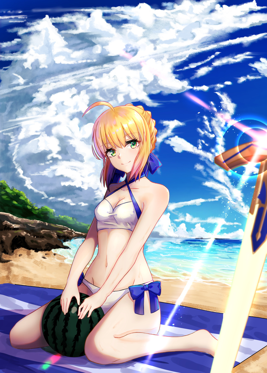 ahoge artoria_pendragon_(all) artoria_pendragon_(swimsuit_archer) bad_id bad_pixiv_id bare_shoulders beach beach_towel bikini blonde_hair blush breasts cleavage cloud day excalibur fate/grand_order fate/stay_night fate_(series) food fruit green_eyes groin hair_ribbon highres looking_at_viewer navel ocean outdoors planted_sword planted_weapon ribbon short_hair sitting sky small_breasts smile solo swimsuit sword towel wariza water watermelon weapon white_bikini yukidaifuku