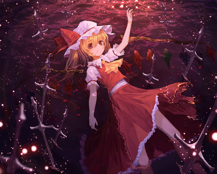 arm_up ascot bangs blonde_hair closed_mouth flandre_scarlet hat hat_ribbon highres lo-ta long_hair long_skirt looking_at_viewer lying mob_cap partially_submerged planted_sword planted_weapon red_eyes red_ribbon red_skirt ribbon skirt skirt_set solo sword touhou vest weapon white_hat wings