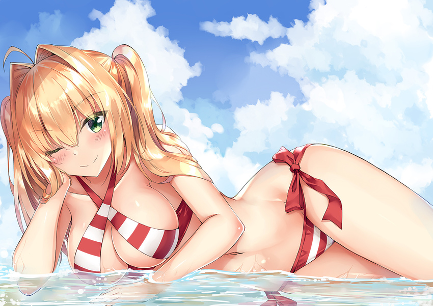 ;) ahoge bikini blonde_hair blue_sky blush breasts cloud criss-cross_halter day eyebrows_visible_through_hair fate/grand_order fate_(series) green_eyes halterneck long_hair looking_at_viewer medium_breasts nero_claudius_(fate)_(all) nero_claudius_(swimsuit_caster)_(fate) one_eye_closed partially_submerged rong_yi_tan side-tie_bikini sky smile solo striped striped_bikini swimsuit twintails