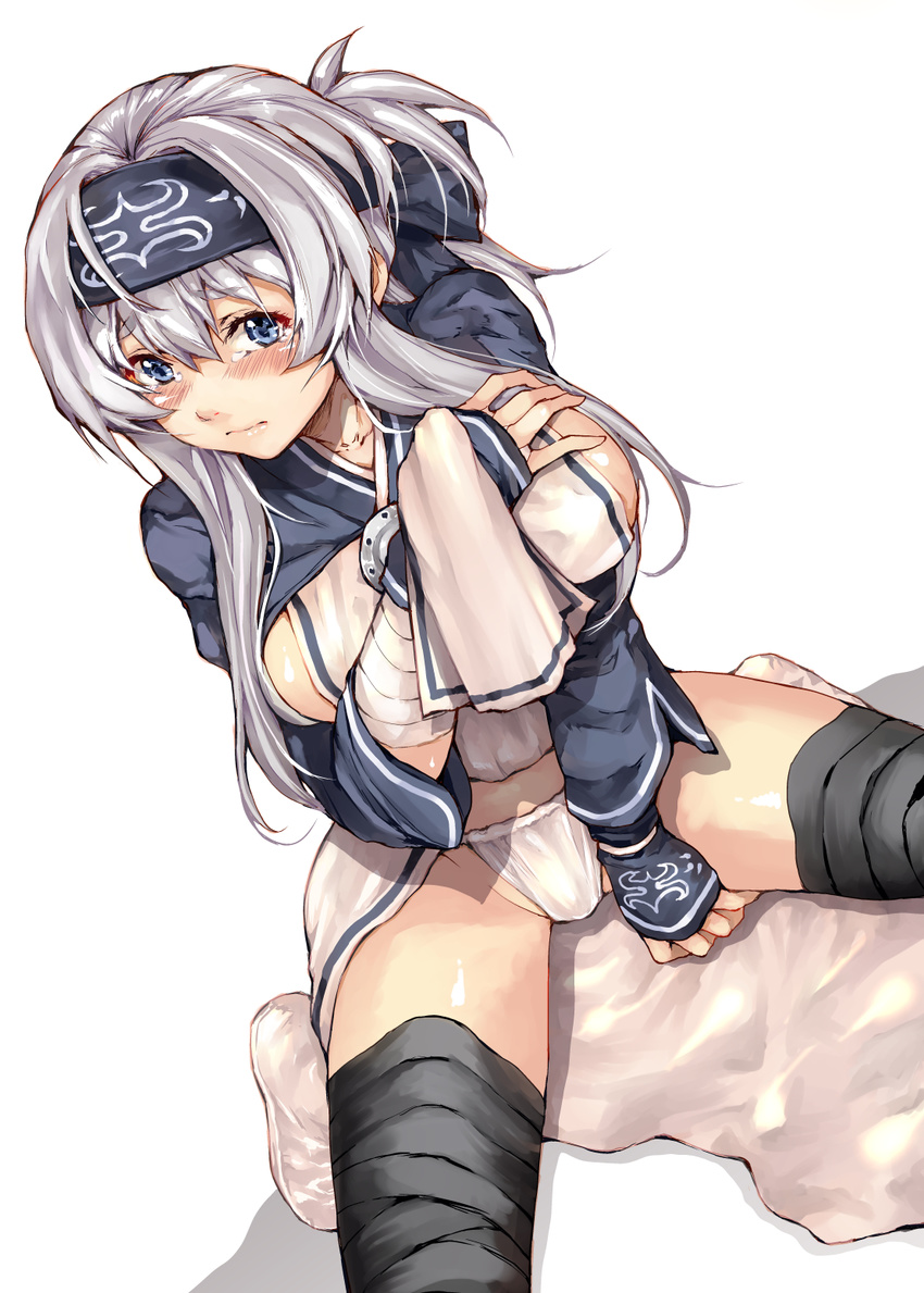 ainu_clothes between_legs black_legwear blue_eyes blush breast_suppress breasts closed_mouth eyebrows_visible_through_hair folded_ponytail grey_hair hand_between_legs headband highres kamoi_(kantai_collection) kantai_collection kurokoeda large_breasts loincloth_lift long_hair looking_at_viewer panties sidelocks sitting solo tears thick_eyebrows thighhighs underwear white_background white_panties