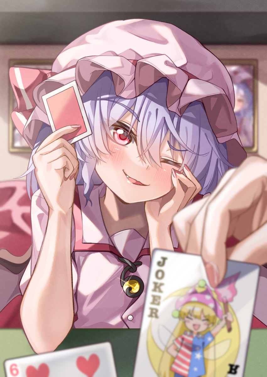 1girl 1other ;d absurdres blue_hair blurry blush brooch card character_print clownpiece commentary depth_of_field elbows_on_table fang female_pov fingernails frills hair_between_eyes hand_on_own_face hands_up happy hat head_tilt highres holding holding_card indoors jewelry joker_(playing_card) long_fingernails mahoro_(minase_mahoro) mob_cap nail_polish one_eye_closed pink_hat pink_shirt playing_card pov red_eyes red_nails red_ribbon remilia_scarlet ribbon shirt smile solo_focus touhou tsurime upper_body yellow_gemstone