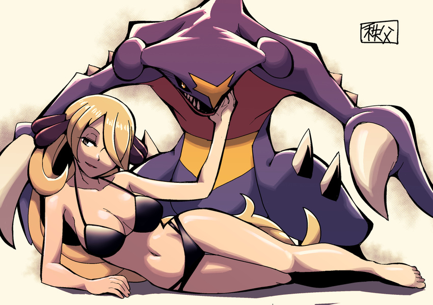 1girl arm_support beige_background bikini black_bikini blonde_hair breasts claws cleavage collarbone dragon full_body garchomp grey_eyes hair_ornament hair_over_one_eye half-closed_eyes hand_up large_breasts leaning_forward long_hair looking_to_the_side looking_up lying navel on_side open_mouth pokemon pokemon_(creature) pokemon_(game) pokemon_dppt sharp_teeth shiny_skin shirona_(pokemon) simple_background smile swimsuit teeth text translation_request watson