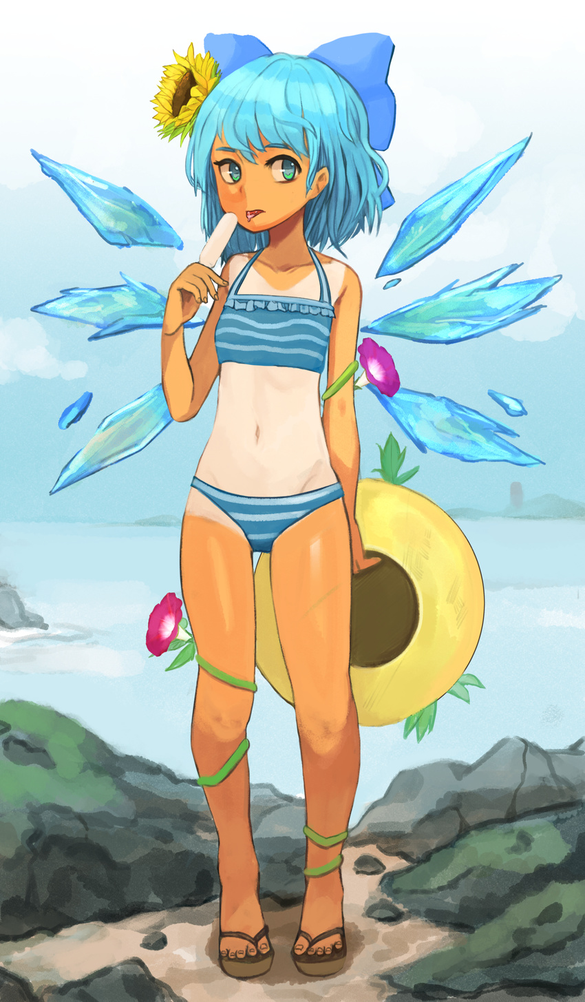 absurdres bangs bare_arms bare_legs bikini blue_bikini blue_bow blue_eyes blue_hair blue_wings bow cirno day flower food full_body hair_bow hair_flower hair_ornament halter_top halterneck hat hat_removed headwear_removed highres holding holding_food ice ice_wings looking_at_viewer morning_glory one-piece_tan outdoors permanentlow popsicle sandals solo standing striped striped_bikini sun_hat sunflower swimsuit tan tanline tanned_cirno tongue tongue_out touhou wings