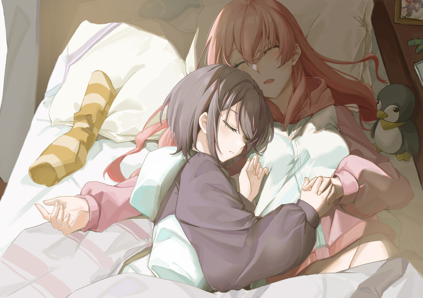 2girls absurdres bandaid bang_dream! bang_dream!_it's_mygo!!!!! blue_hoodie chihaya_anon closed_eyes commentary_request cuddling fang grey_hair grey_hoodie head_on_another's_shoulder highres holding_hands hood hoodie indoors interlocked_fingers long_hair multiple_girls on_bed open_mouth pajamas photo_(object) pink_hair pink_hoodie short_hair sleeping stuffed_animal stuffed_penguin stuffed_toy takamatsu_tomori two-tone_hoodie under_covers unworn_socks yuko_(user_uuju2584) yuri