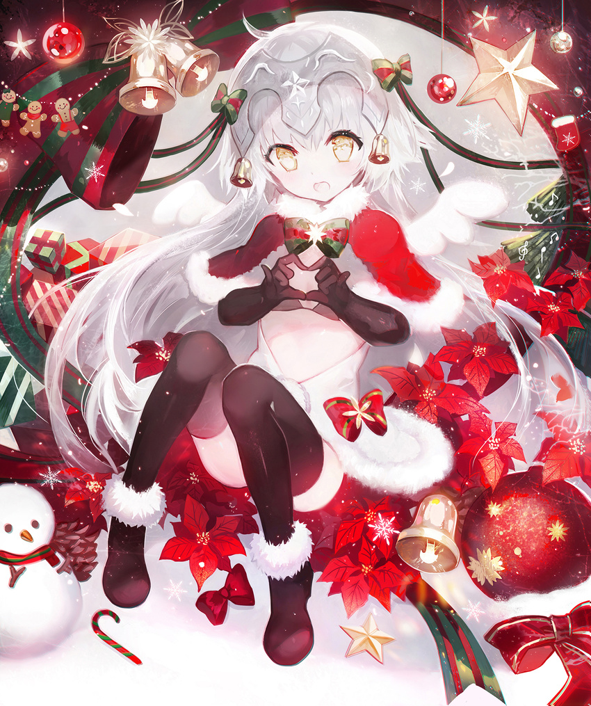 bell black_bikini_top black_gloves black_legwear blush bow box candy candy_cane capelet christmas christmas_ornaments elbow_gloves fate/grand_order fate_(series) food fur_trim gift gift_box gingerbread_man gloves green_ribbon hair_ribbon headpiece heart heart_hands highres jeanne_d'arc_(fate)_(all) jeanne_d'arc_alter_santa_lily long_hair looking_at_viewer moemoe3345 open_mouth ribbon snowman solo striped striped_bow striped_ribbon thighhighs wings yellow_eyes
