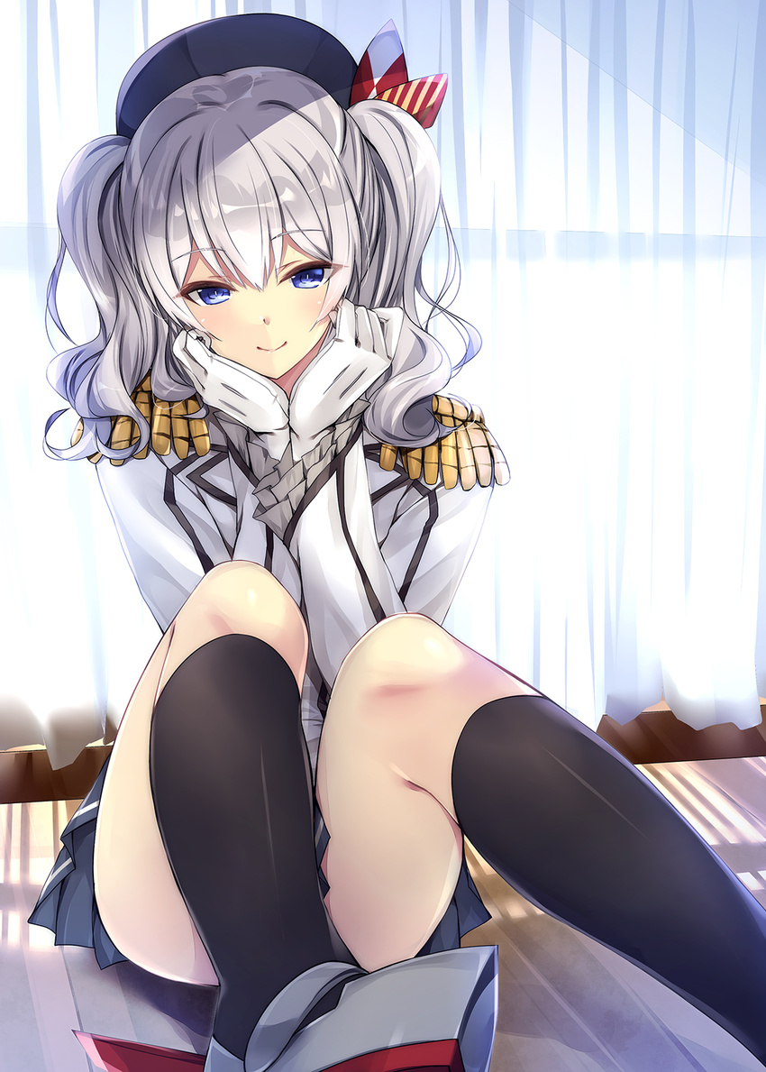 beret black_hat black_legwear black_skirt blue_eyes blue_skirt closed_mouth curtains day epaulettes eyebrows_visible_through_hair frilled_sleeves frills gloves hands_on_own_cheeks hands_on_own_face hat highres indoors jacket kantai_collection kashima_(kantai_collection) kneehighs kobayashi_chisato long_hair long_sleeves looking_at_viewer military military_uniform pleated_skirt shadow shoes silver_hair sitting skirt smile socks solo two_side_up uniform white_gloves white_jacket window
