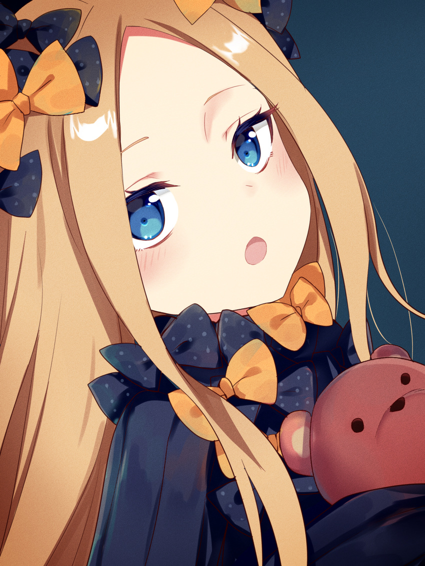 :o abigail_williams_(fate/grand_order) bangs black_bow black_dress blonde_hair blue_background blue_eyes blush bow commentary_request dress fate/grand_order fate_(series) forehead hair_bow head_tilt highres long_hair long_sleeves looking_at_viewer object_hug open_mouth orange_bow parted_bangs polka_dot polka_dot_bow sada_(sadahalu) simple_background sleeves_past_fingers sleeves_past_wrists solo stuffed_animal stuffed_toy teddy_bear very_long_hair