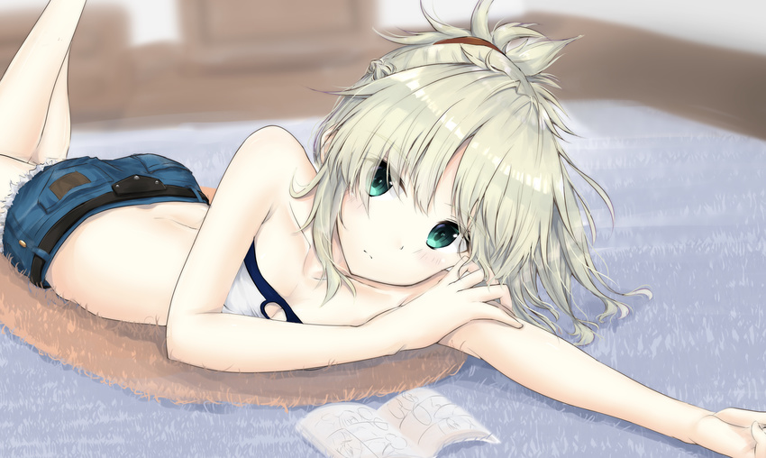 absurdres arm_rest bangs bare_arms bare_shoulders blonde_hair blurry blurry_background book breasts closed_mouth collarbone crop_top denim denim_shorts eyebrows_visible_through_hair eyes_visible_through_hair fate/apocrypha fate_(series) green_eyes hair_ornament hair_over_one_eye highres indoors long_hair looking_at_viewer lying mordred_(fate) mordred_(fate)_(all) on_stomach outstretched_arm ponytail short_shorts shorts simple_background sleeveless small_breasts solo strapless uzuki_tsukuyo