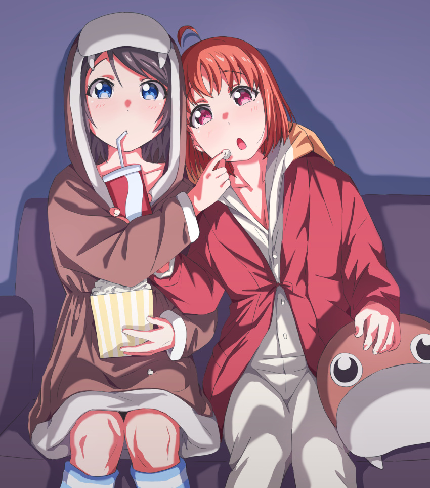 absurdres animal_hood bangs blue_eyes couch cup drinking_glass feeding food gamjolno grey_hair highres hood long_sleeves love_live! love_live!_sunshine!! multiple_girls open_mouth orange_hair popcorn red_eyes sitting takami_chika uchicchii walrus_costume watanabe_you