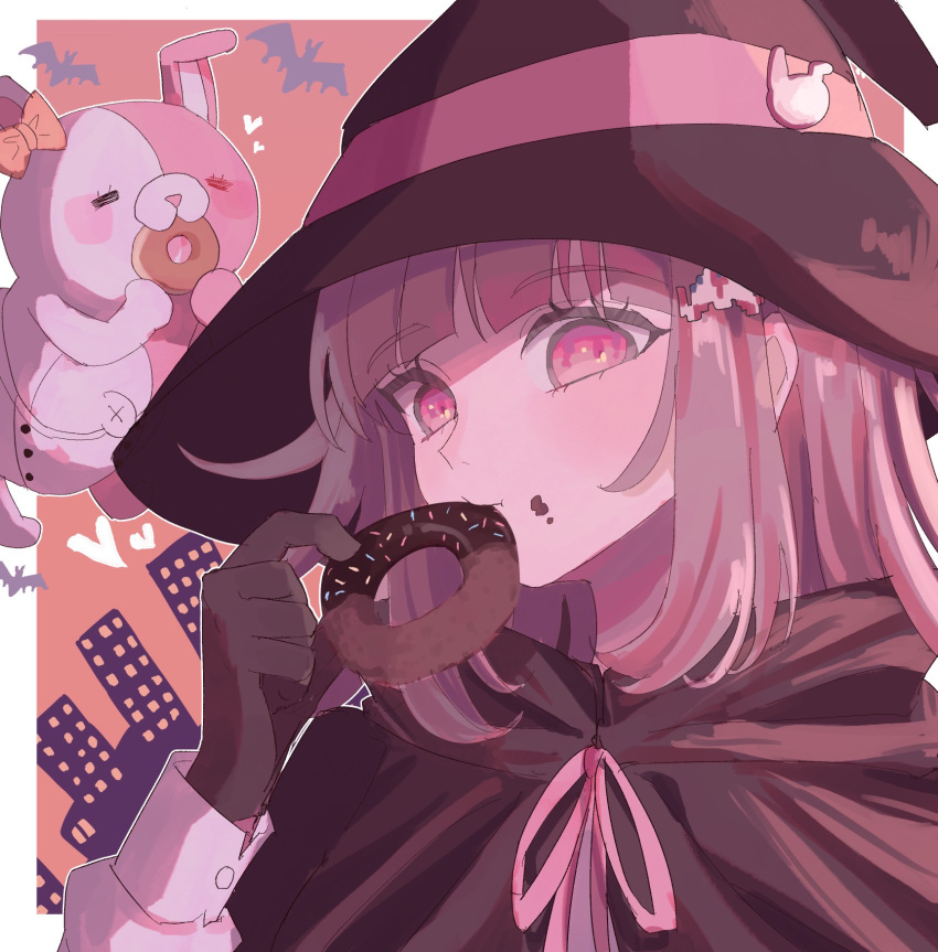 1girl bat_(animal) bow brown_cape brown_gloves cape danganronpa_(series) danganronpa_2:_goodbye_despair diaper doughnut ear_bow eating food galaga gloves hair_ornament hand_up hat heart highres ibushi_(kuyuru_29) long_sleeves medium_hair monomi_(danganronpa) nanami_chiaki orange_background pink_eyes pink_hair solo upper_body witch witch_hat