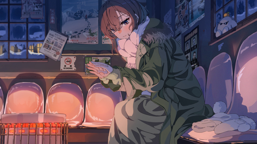 1girl ad blush brown_eyes brown_hair closed_mouth coat commentary_request cowboy_shot dim_lighting fur-trimmed_coat fur_trim gloves glowing green_coat green_skirt green_sweater hair_between_eyes heater highres indoors long_skirt looking_at_object medium_hair mittens on_chair original sakatsuki_yakumo scarf sign sitting skirt smile snow solo sweater unworn_gloves warming_hands white_gloves window winter