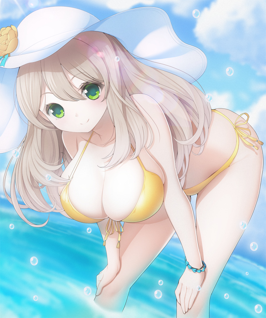 1girl ass bare_arms bare_legs bare_shoulders bikini blue_archive breasts cleavage closed_mouth collarbone day feet_out_of_frame green_eyes hair_between_eyes hands_on_own_knees hat highres koflif large_breasts light_brown_hair long_hair looking_at_viewer nonomi_(blue_archive) nonomi_(swimsuit)_(blue_archive) ocean outdoors smile solo sun_hat swimsuit water white_headwear yellow_bikini