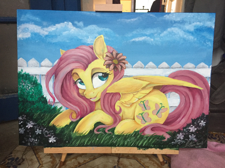 2016 4:3 blue_eyes cutie_mark day dennyvixen equine feathered_wings feathers female fence feral flower fluttershy_(mlp) friendship_is_magic fur grass hair hooves lying mammal my_little_pony open_mouth outside painting_(artwork) pegasus pink_hair plant sky smile solo tongue traditional_media_(artwork) wings yellow_feathers yellow_fur