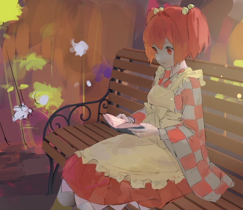 apron bangs bell bench book bow closed_mouth commentary_request dress hair_bell hair_between_eyes hair_bow hair_ornament highres long_sleeves motoori_kosuzu open_book orange_dress orange_hair park_bench pikumin reading red_eyes short_hair short_twintails sitting smile solo touhou twintails wide_sleeves yellow_apron