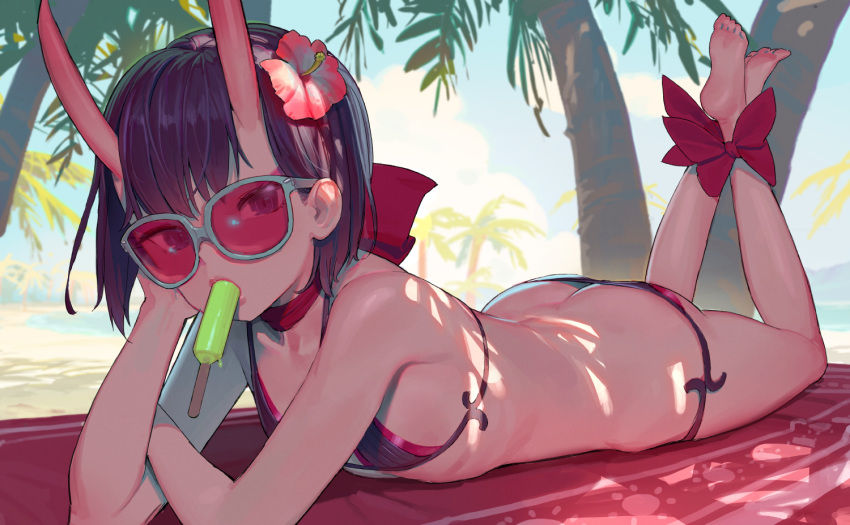 ankle_bow ankle_ribbon ass bangs bare_shoulders barefoot beach bikini black_bikini blue_sky bow butt_crack choker cloud collarbone day fate/grand_order fate_(series) feet flat_chest flower food food_in_mouth full_body hair_flower hair_ornament hibiscus horns legs_up lips looking_at_viewer lying mouth_hold ocean on_stomach outdoors palm_tree popsicle red_bow red_ribbon ribbon ribbon_choker short_hair shuten_douji_(fate/grand_order) sky soles solo string_bikini sunglasses swimsuit the_pose tim_loechner tree water